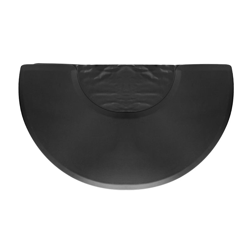 Covoraș de coafură sub un fotoliu semicircular